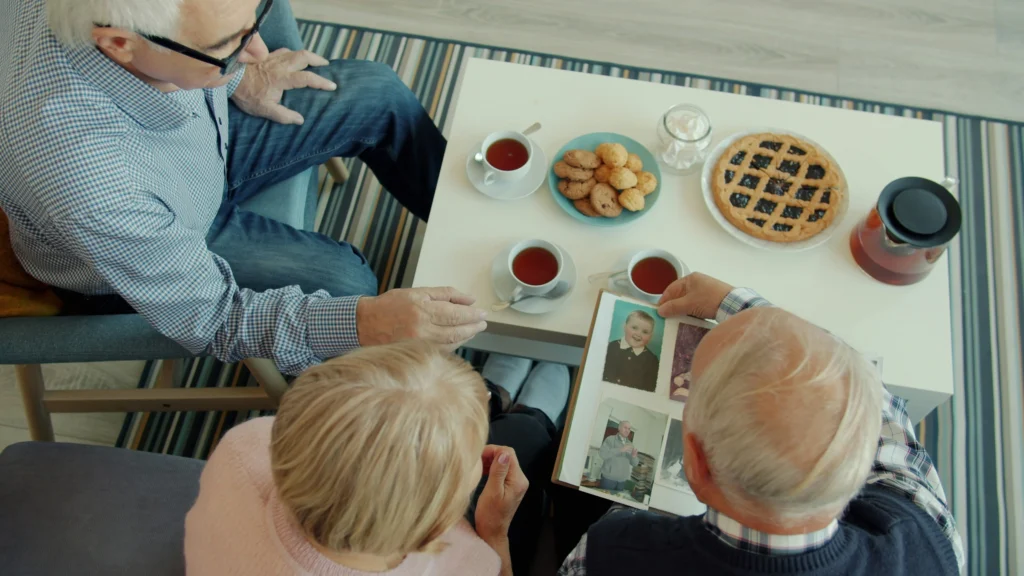family photos and personal keepsakes set up in senior's new assisted living room on move-in day