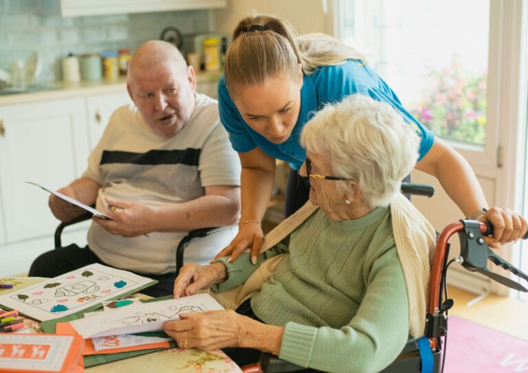 Adult daughter helping elderly mother at home