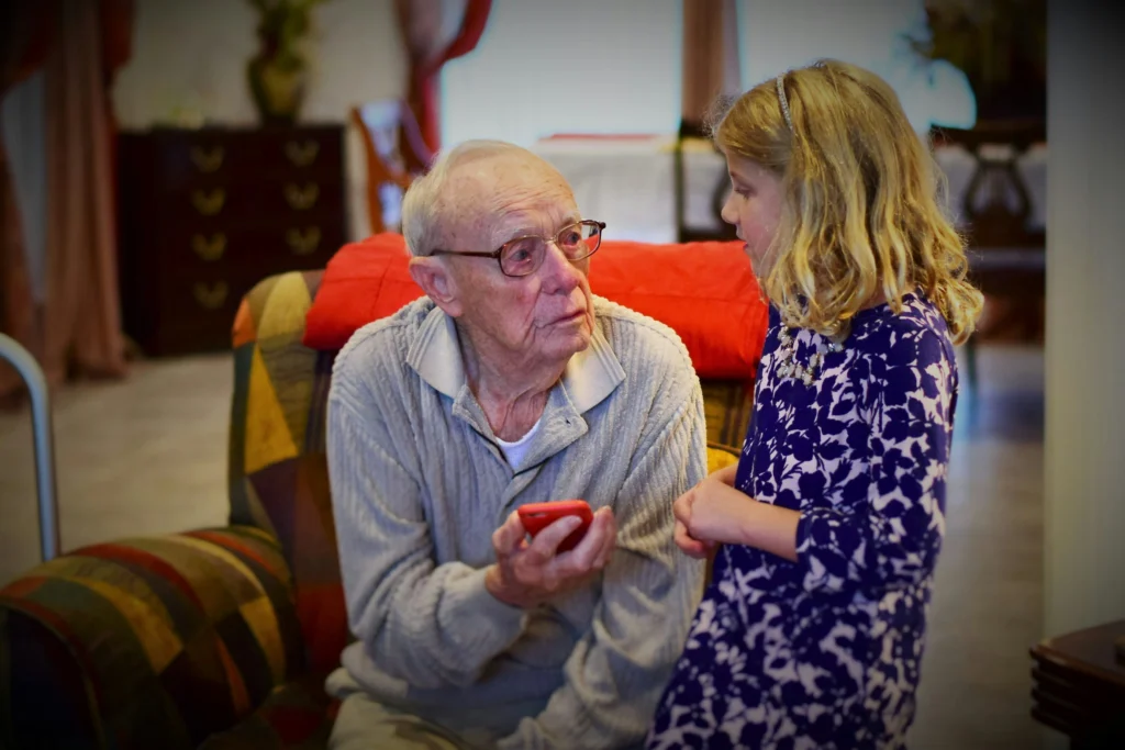 adult child talking elderly parent serious conversation