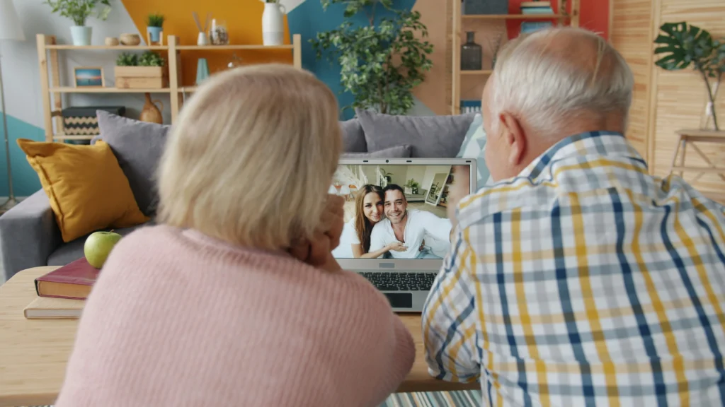 family talking elderly parent together