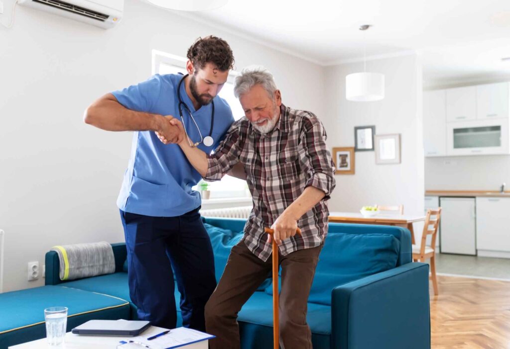 Professional caregiver assisting an elderly parent with daily activities at home