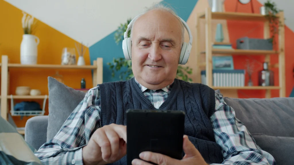 elderly person listening music headphones