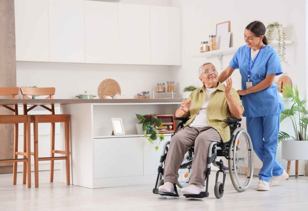 Private caregiver assisting a senior client one-on-one at home