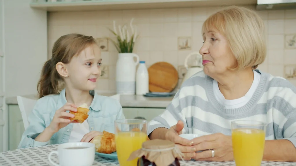 Caregiver doing trivia with senior with dementia during morning routine