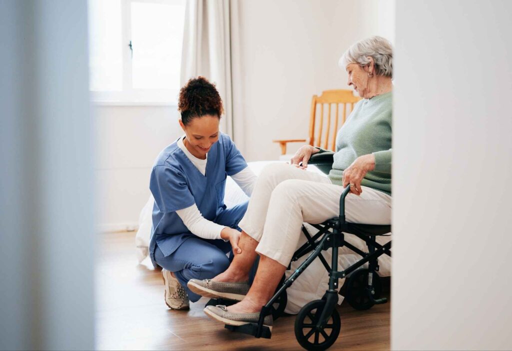 Caregiver assisting a resident with daily activities in assisted living