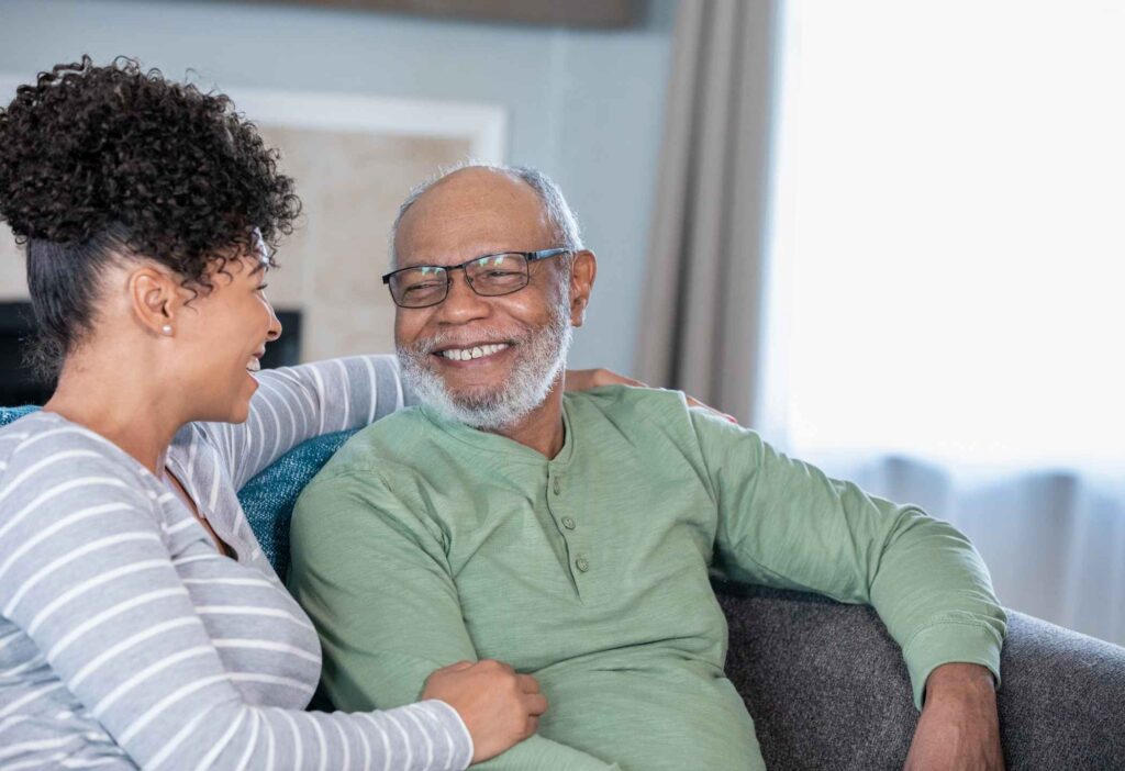 Family touring an assisted living facility and speaking with staff